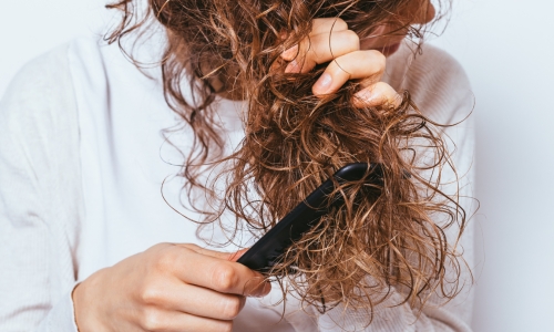 Tired of Frizz? Discover the Salon Secrets to Strong, Healthy Hair